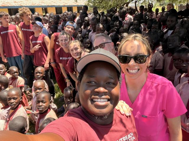 Selfie with schoolchildren and the outreach team