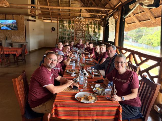 The team sharing a meal